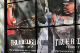 Premium Wallscape on storefront street Ads in Paris