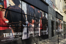 Premium Wallscape on storefront street Ads in Paris